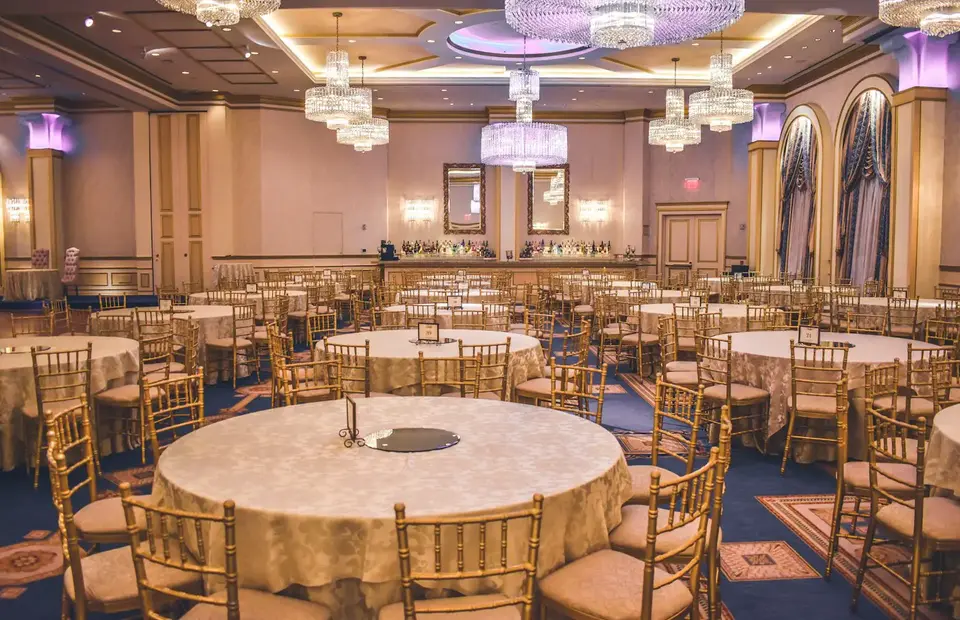 Ballroom lit with warm professional event lighting